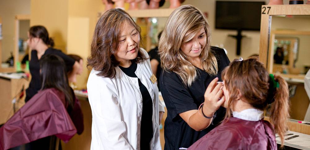 cosmetology instructor teaching student