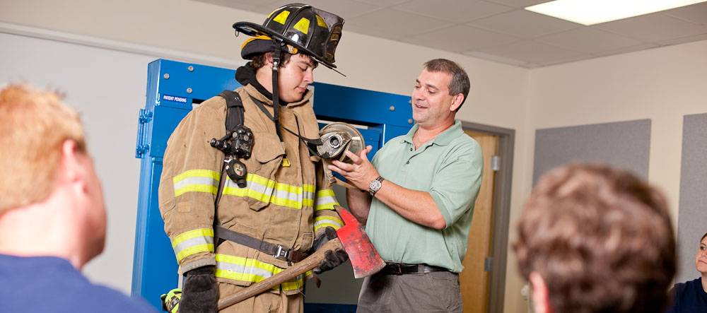 fire protection intructor showing teaching student
