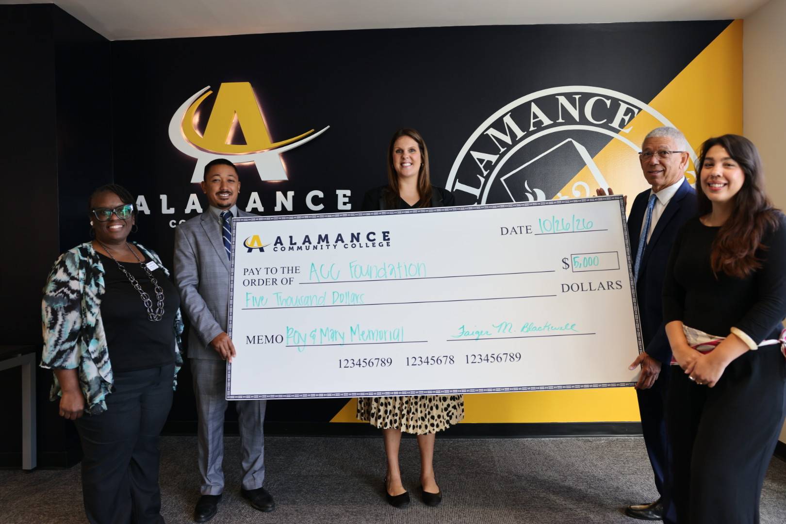 Members of the Blackwell Funeral Home and the ACC Foundation during a check presentation.