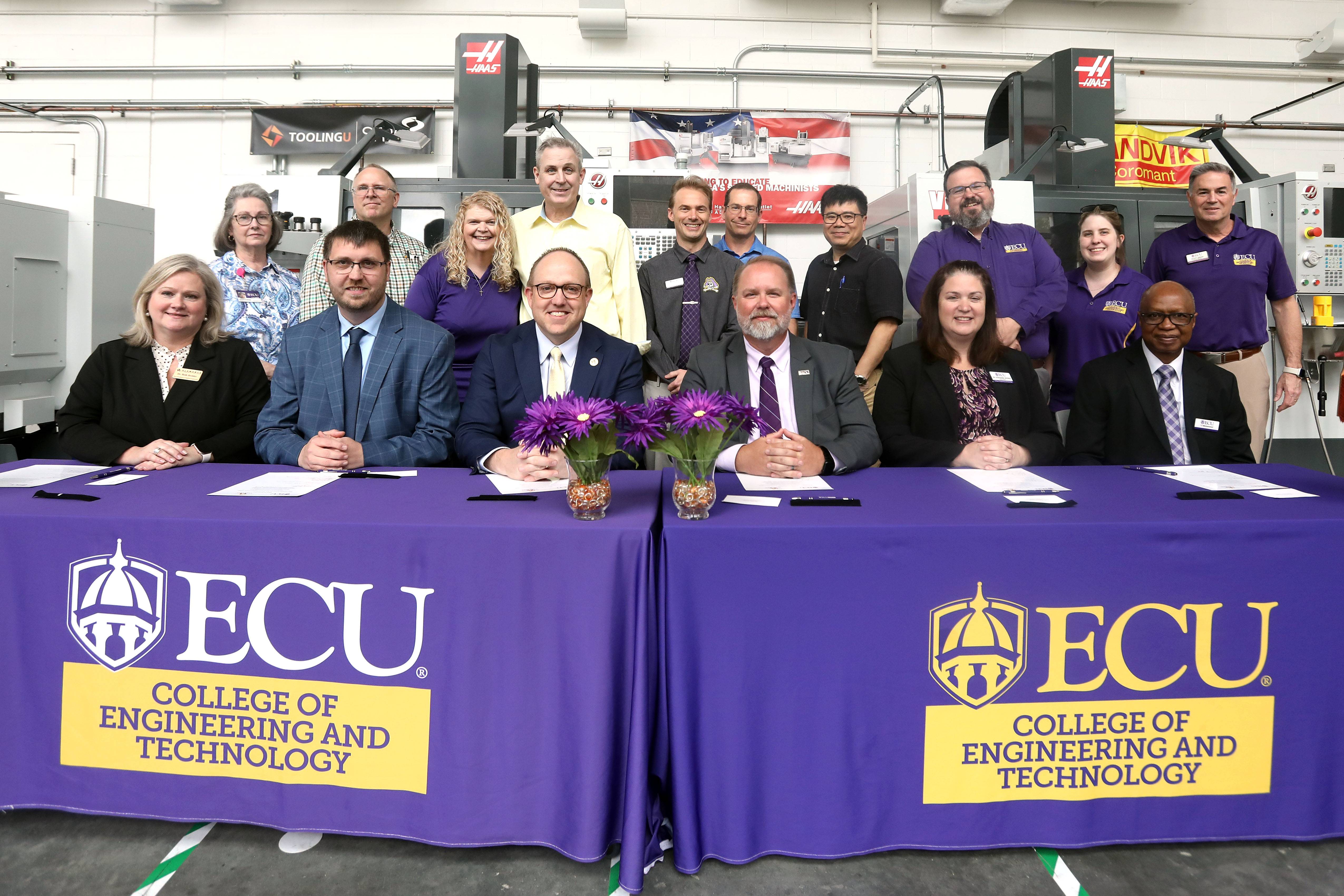 ACC and ECU leadership signing an MOU agreement