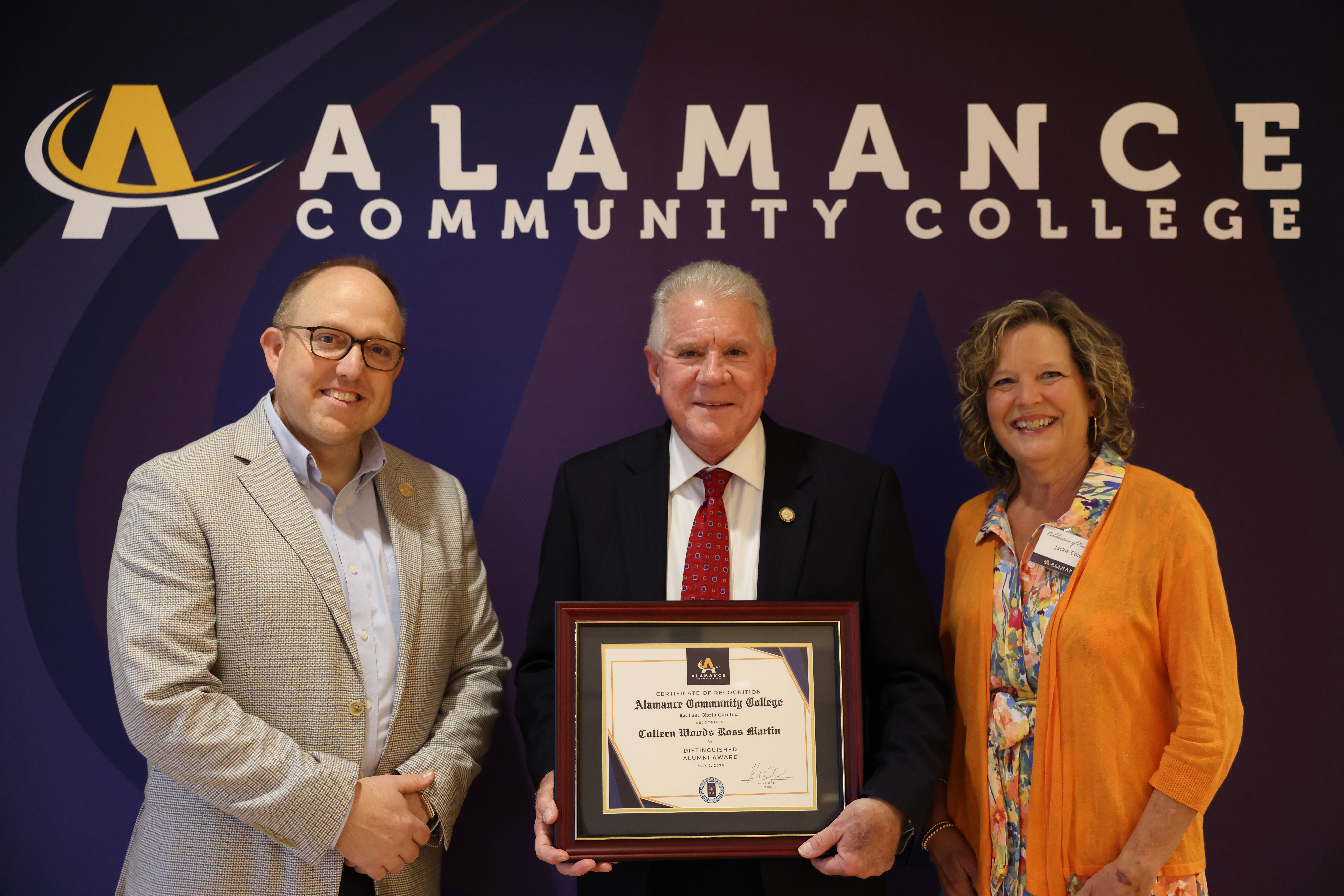 Representative Ross receives the Distinguished Alumni Award, in honor of his late mother.