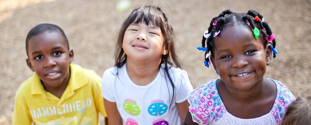 three small children in the child care center