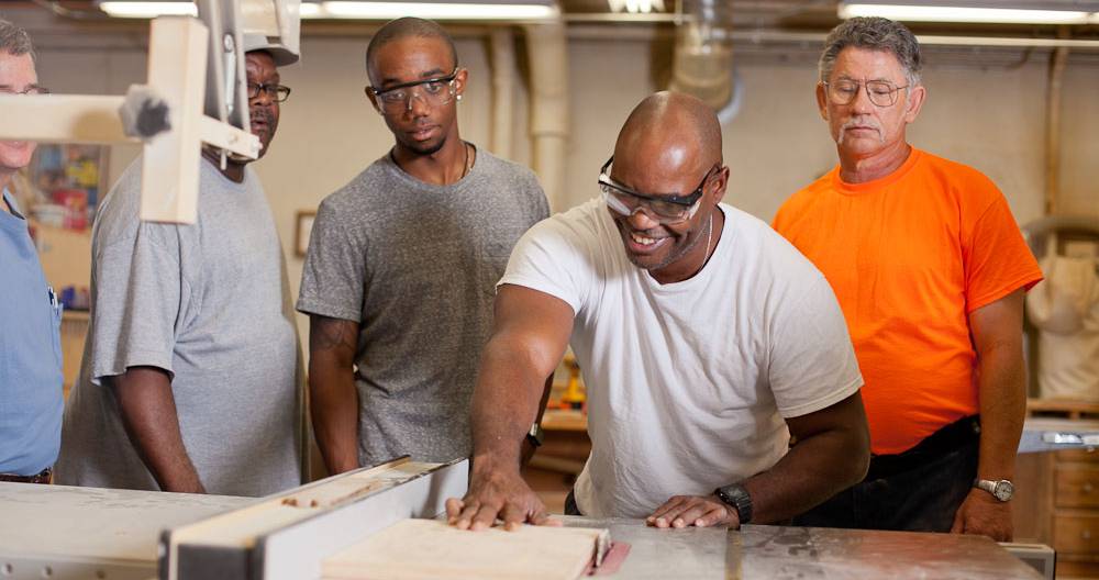 students getting instruction from contruction teacher