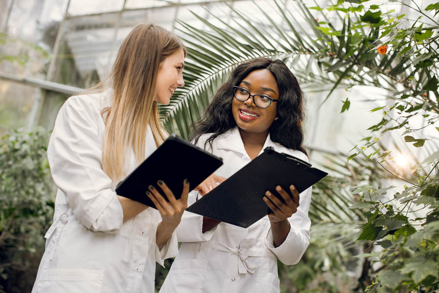 Agricultural Biotechnology students holding clipboards