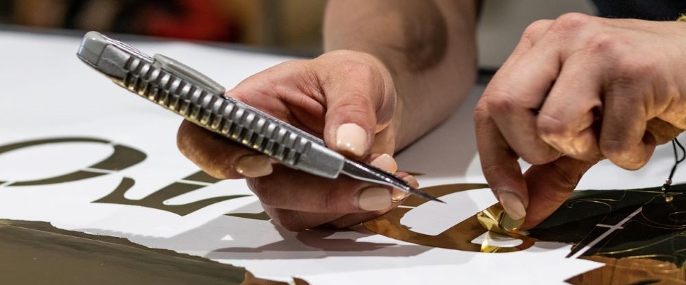 image of hands weeding vinyl