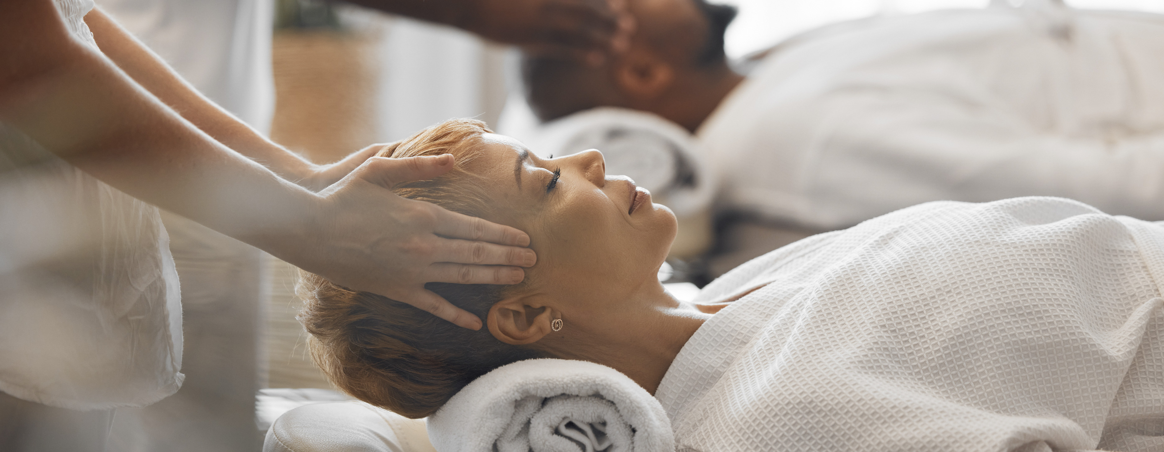 massage therapy students Massage therapist gently supports a client’s head during a massage therapy session.