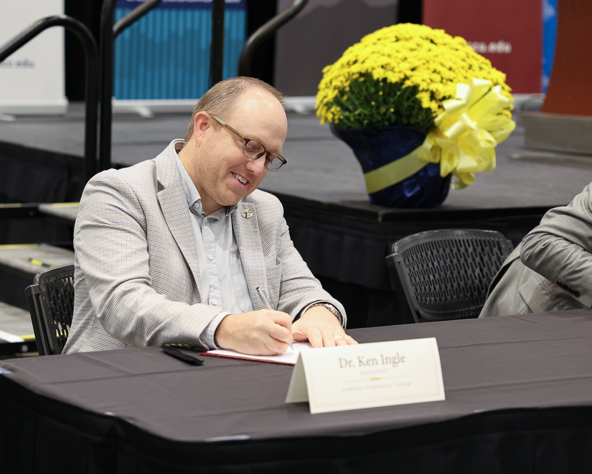 Dr. Ken Ingle signs the eagle connect agreement